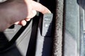 A man pulls the handle to open the gas tank, refueling cars