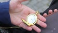 Man pulls out of his pocket vintage pocketwatch on a chain and looking time