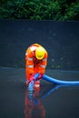 Man pumping flood water away in Devon uk