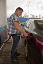 Man pumping Gas at the Gas Station Royalty Free Stock Photo