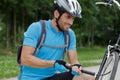 man pumping up bike tire outdoors Royalty Free Stock Photo