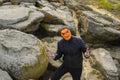 Man in a pumpkin mask in the mountains. Royalty Free Stock Photo