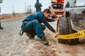 A man pumps air wheel with a compressor Royalty Free Stock Photo