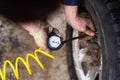 A man pumps air wheel with a compressor Royalty Free Stock Photo