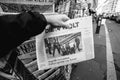 Man purchases Die Zeit newspaper from press kiosk after London a