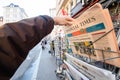 Man purchases a Financial times newspaper from press kiosk after