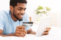Man purchasing product online, using credit card to pay