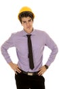 Man in purple dress shirt and hard hat hands on hips Royalty Free Stock Photo