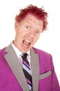 Man in a purple suit close mouth open purple hair Royalty Free Stock Photo