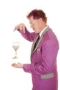 Man purple suit drink between hands side