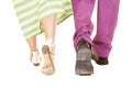 Man purple suit woman green dress walk away feet Royalty Free Stock Photo