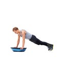 Man, push up for exercise and balance, bosu ball for core training and muscle in workout on white background. Fitness