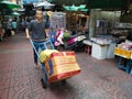 Man pushes a hand truck