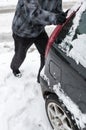 Man pushing car stuck in snow Royalty Free Stock Photo