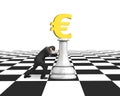 Man pushing money chess of golden euro currency Royalty Free Stock Photo