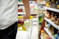 Man pushing shopping trolley