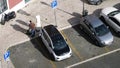 man put on charge new BMW i3 electric mini car time lapse