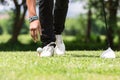 Man put golf ball Royalty Free Stock Photo