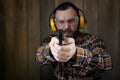 Man with put on protective goggles and ear training in pistol sh Royalty Free Stock Photo