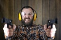 Man with put on protective goggles and ear training in pistol sh Royalty Free Stock Photo