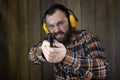 Man with put on protective goggles and ear training in pistol sh Royalty Free Stock Photo