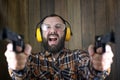 Man with put on protective goggles and ear training in pistol sh Royalty Free Stock Photo