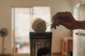 Man put Whey protein powder into the shaker.