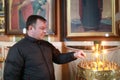 Man puts candle for health in Church Royalty Free Stock Photo