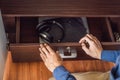 A man puts gadgets in a cabinet for digital detox