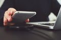 Man puts mobile phone on wireless charger Royalty Free Stock Photo