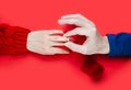 Man puts a ring on a girl`s finger. Marriage proposal. Close-up. Top view