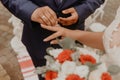 man puts a ring on woman ring finger as a sign of his love at a wedding Royalty Free Stock Photo