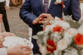 man puts a ring on woman ring finger as a sign of his love at a wedding Royalty Free Stock Photo