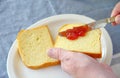 Strawberry jam spread on bread