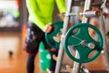 The man puts weight on the bar in the gym. Royalty Free Stock Photo