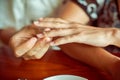 man puts woman engagement ring Royalty Free Stock Photo