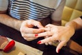 Man puts woman an engagement ring in cafe Royalty Free Stock Photo