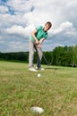 Man putting ball inside short putt Royalty Free Stock Photo