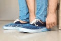 Man putting on blue shoe covers Royalty Free Stock Photo