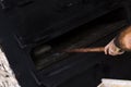 Man putting bread dough in the wood oven Royalty Free Stock Photo