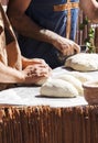 Man putting bread dough in the wood oven Royalty Free Stock Photo