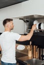 Man putting clean plates in plate