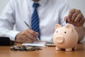 man putting coin in piggy bank Royalty Free Stock Photo