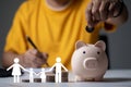 man putting coin in piggy bank Royalty Free Stock Photo