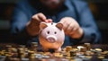 Man putting coin into piggy bank, saving money for future Royalty Free Stock Photo