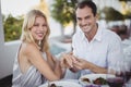 Man putting engagement ring on womans hand Royalty Free Stock Photo