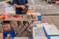 Man putting fresh squid in plastic at local farmers market Royalty Free Stock Photo