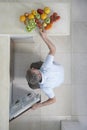 Man Putting Fruits In Refrigerator Royalty Free Stock Photo