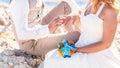 Man putting on golden ring in a woman's finger Royalty Free Stock Photo