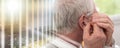 Man putting hearing aids  multiple exposure Royalty Free Stock Photo